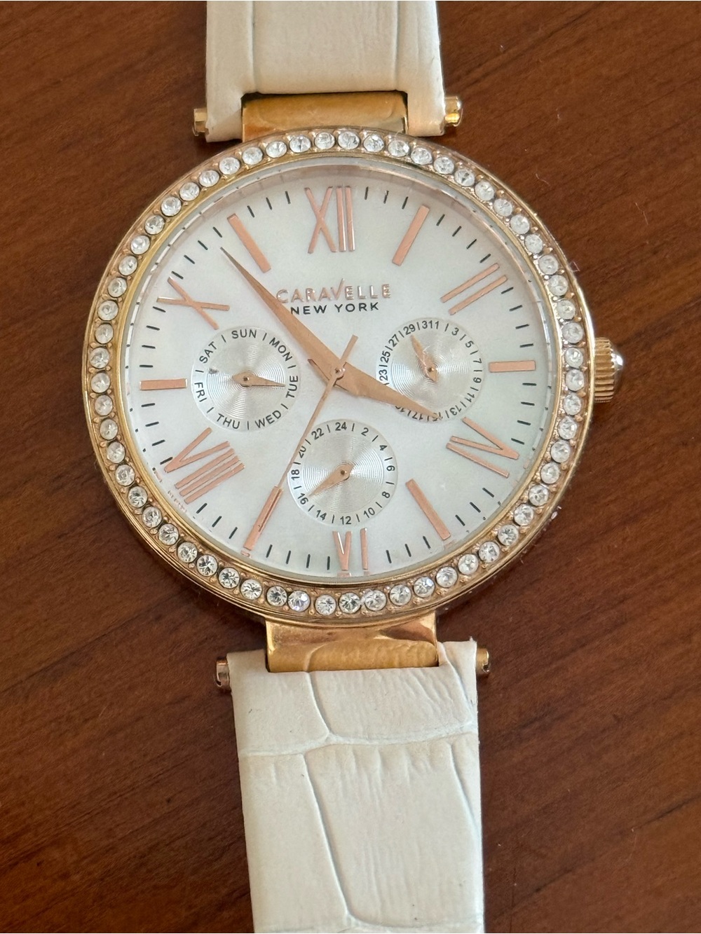 Caravelle New York Women's Cream Strap Watch with Rose Gold Crystal Bezel